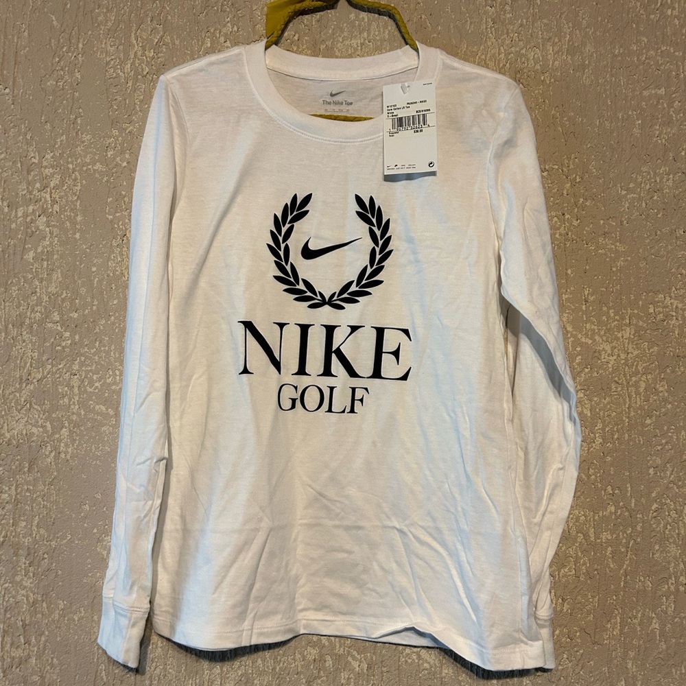 New Nike women’s white golf long sleeve shirt XSmall with tags still on it.